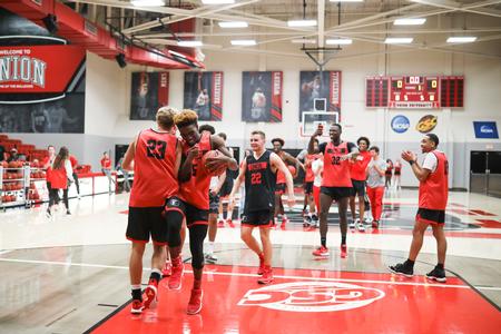 The Bulldog basketball team members compete in a dunking contest during Bulldog Madness. - Photo by Kristi McMurry Woody