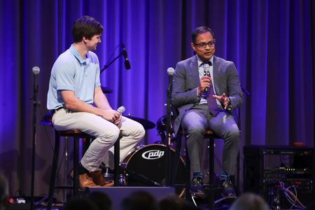 Stephen Neu, coordinator for service and mobilization, interviews Santhosh Abraham, associate professor of accounting, during chapel. - Photo by Kristi McMurry Woody