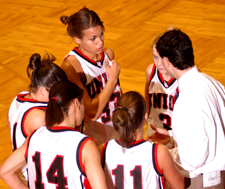 Coach Mark Campbell gives five of his players some quick instructions during the championship game of the NAIA National Tournament. Union won 67-63. - Photo by Morris Abernathy