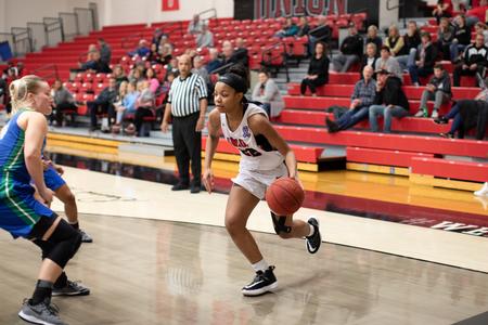 Kieli Robinson plays in a basketball game against West Florida. - Photo by Kristi McMurry Woody