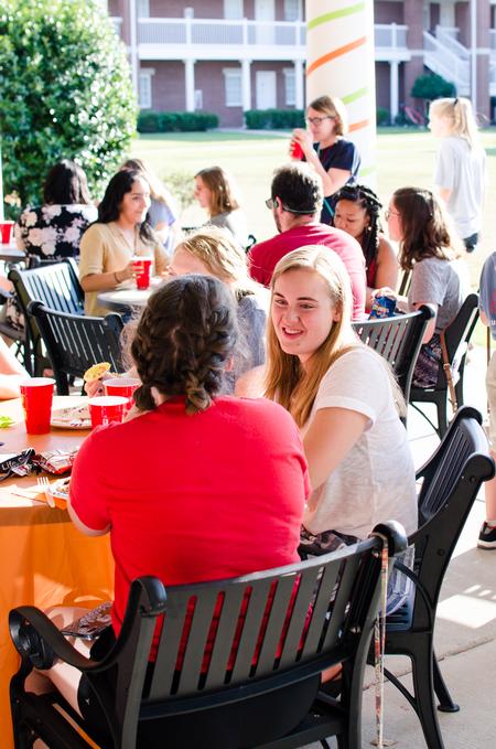 Students enjoy food at the MOSAIC cook-out at the Bowld Student Commons.  - Photo by Jess Newendyke