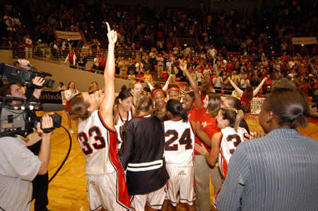 The Union players celebrate with each other on the court after their 67-63 win in the championship game of the NAIA National Tournament. - Photo by Morris Abernathy