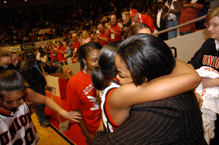 Senior guard Monica Elliot and Graduate Assistant Coach Tonya Tuggles exchange a hug after Union's win in the championship game of the NAIA National Tournament. - Photo by Morris Abernathy