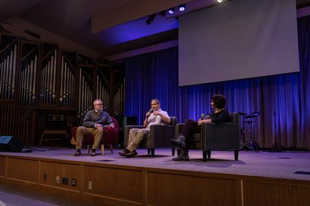 Todd Brady, vice president for university ministries, interviews Fonsie and Leslie Guilaran during chapel. - Photo by Joey Echeverria