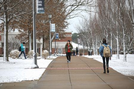 Students walk to class after a dusting of snow on campus.  - Photo by Kristi McMurry Woody