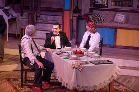 Joey Echeverria (center), digital media communications major, performs as Tony in the UU Theatre production of "You Can't Take It With You." - Photo by Kristi McMurry Woody