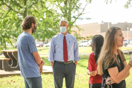 David Thomas, university professor of history, chats with students during the Honors Program coffee hour. - Photo by Kristi McMurry Woody