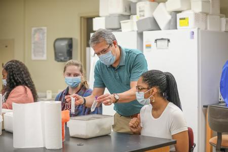 10/7/20 - William Thierfelder, associate professor of biology, hands out materials for an assignment in Immunology. - Kristi McMurry Woody