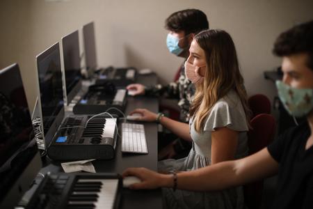 Students work on a project during their commercial music lab. - Photo by Kristi McMurry Woody