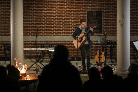A student performs in Open Mic Night on the Bowld Student Commons patio. - Photo by Kristi McMurry Woody
