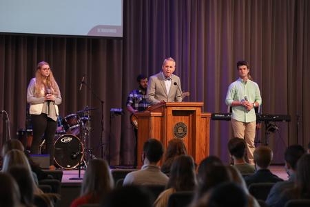 Dub Oliver, president of the university, joins students in chapel for a time of prayer and worship. - Photo by Sarah Palmer Goff