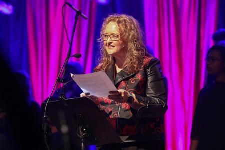 Kelly Garner, associate professor of contemporary voice and worship technology, does a reading during A Thankful Christmas. - Photo by Sarah Palmer Goff
