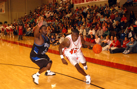 Corey Burkett (45) drives around a Mountain State defender in Union Homecoming win. - Photo by Morris Abernathy