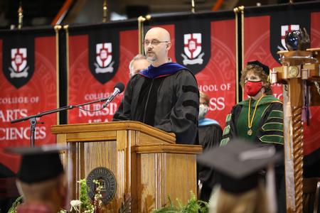 12/12/20 - Joshua Veltman, professor of music, reads scripture during Fall Graduation. - Kristi McMurry Woody