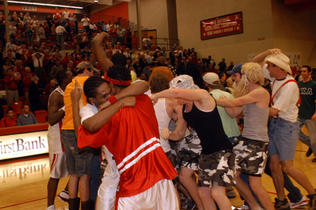 Homecoming fans flooded the court after the Bulldogs defeated Mountain State University, the defending NAIA national champion and the top-ranked NAIA team in the country, 78-75. - Photo by Morris Abernathy