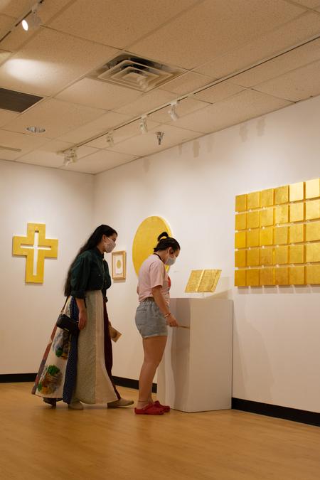 Students view the work of Sandra Bowden in the Union Art Gallery. - Photo by Naomi Mengel