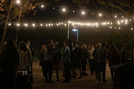 Students mingle outside the fountain during the Homecoming 2020 kickoff event. - Photo by Joey Echeverria