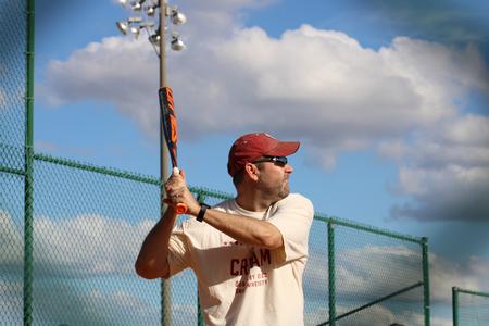 Tim Ellsworth, associate vice president for university communications, bats during the Homecoming Dub Derby. - Photo by Abigail Aspinwall