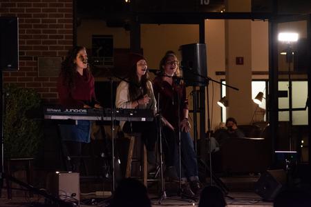 Students perform outside Barefoots Joe during Open Mic Night. - Photo by Naomi Mengel