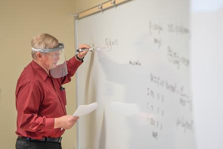 1/13/21 - Michael Hayes, professor of chemistry and department chair, writes on the board for his students. - Kristi McMurry Woody