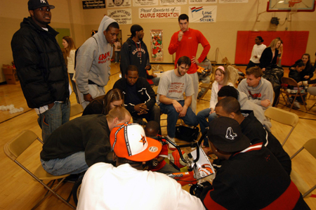 Members of the men's basketball team take some time out to spread some Christmas cheer with local students at the Carl Perkins Christmas Special. - Photo by Morris Abernathy