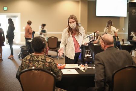 Lynna Mockford, special education major, talks with reps from companies during the Education Expo. - Photo by Kristi McMurry Woody