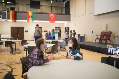Spring Break GO Trip students gather for a dinner and games with international students. - Photo by Kristi McMurry Woody