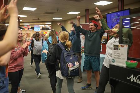 Res Life staff welcomes students to Food for Finals. - Photo by Kristi McMurry Woody