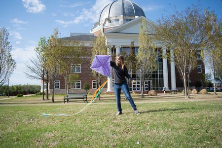 Students fly kites on the great lawn during SAC's Backyard Bash week. - Photo by Naomi Mengel