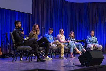 Students sit on a panel during chapel. - Photo by Naomi Mengel