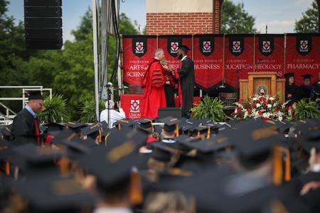 Richard Kidd, worship leadership graduate, receives his diploma during spring commencement. - Photo by Kristi McMurry Woody