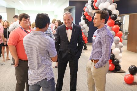 Dub Oliver, president of the university, laughs with alumni during the SBC alumni gathering. - Photo by Kristi McMurry Woody