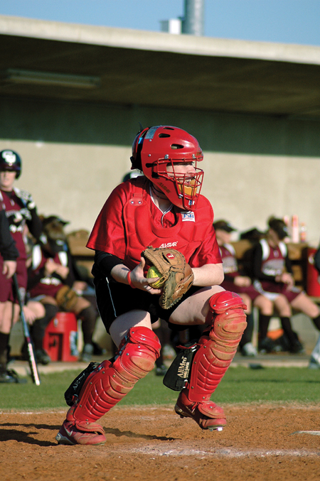 Kylie Sullivan attempts to throw out a runner trying to steal a base. - Photo by Amanda Herron