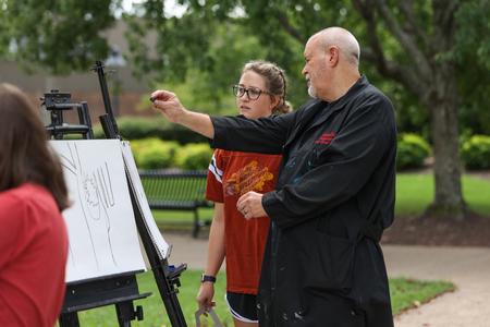 9/1/21 - Students in Drawing 1 do a drawing exercise outside during class. - Kristi McMurry Woody