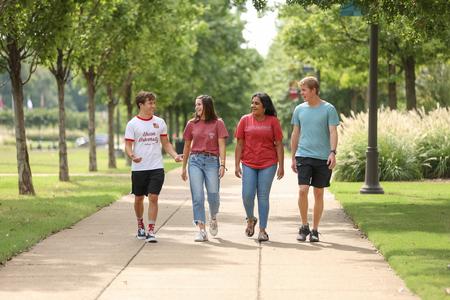 Students walk along the Great Lawn in front of the Logos. - Photo by Kristi McMurry Woody