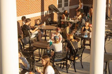 Students enjoy a Labor Day block party outside the Bowld Commons. - Photo by Abigail Aspinwall