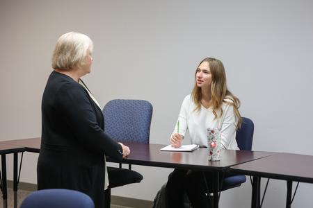 10/11/21 - Melessia Mathis, assistant professor of education, talks with Treava Schmitter-Schrier, special education major, before class. - Kristi McMurry Woody