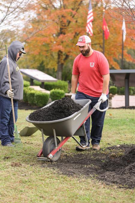 Members of the Phi Alpha Theta history honor society work on some outdoor projects at a local Jackson park during Campus & Community Day. - Photo by Kristi McMurry Woody