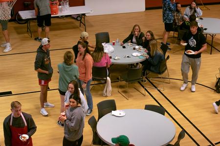 Students enjoy time with friends during the ATO chili cook-off.  - Photo by Faith Orr