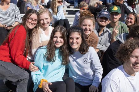 Students pose together as they enjoy the Buster Bowl during Homecoming 2021. - Photo by Abigail Aspinwall