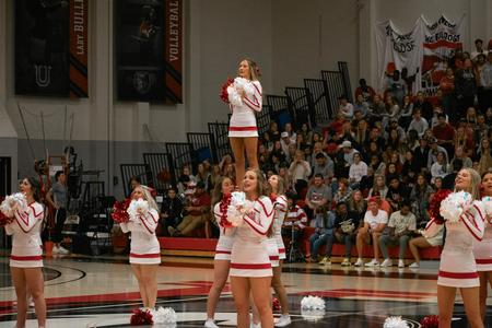 Cheerleaders pump up the crowd during the Homecoming basketball game. - Photo by Faith Orr
