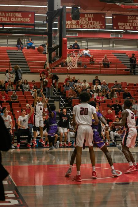Tyree Boykin shoots a 3-pointer during the Homecoming 2021 game. - Photo by Faith Orr
