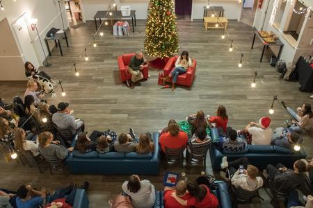 Dub and Susie Oliver, president and first lady of the university, sing Christmas carols with students during Christmas with the Olivers. - Photo by Abigail Aspinwall