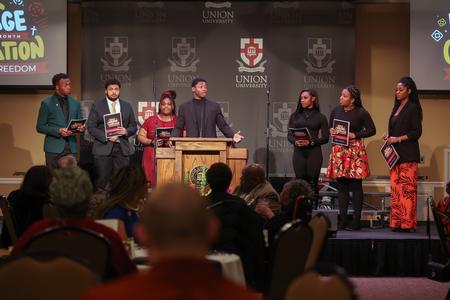 Leaders in the Black Student Union lead a responsive reading during the Black Heritage Month Celebration. - Photo by Kristi McMurry Woody