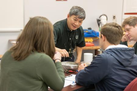 Don Van, professor of engineering, works with students on a lab assignment. - Photo by Kristi McMurry Woody