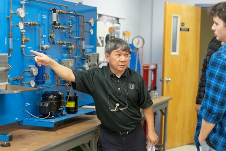 Don Van, professor of engineering, works with students on a lab assignment. - Photo by Kristi McMurry Woody