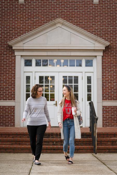 Rachel Graves chats Renee Litscher, assistant professor of nursing, outside White Hall. - Photo by Kristi McMurry Woody