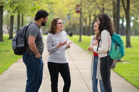 Jeremiah Chapman, Rachel Graves, and Maria Wentley chat with Renee Litscher, assistant professor of nursing. - Photo by Kristi McMurry Woody