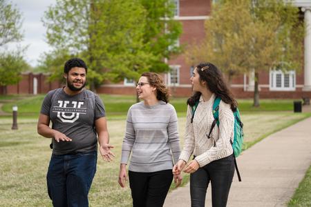 Jeremiah Chapman and Maria Wentley chat with Renee Litscher, assistant professor of nursing, outside White Hall. - Photo by Kristi McMurry Woody