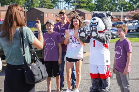 Union freshman, McKenzie Harris, poses with Buster and her family during move-in day. - Photo by Suzanne Rhodes
